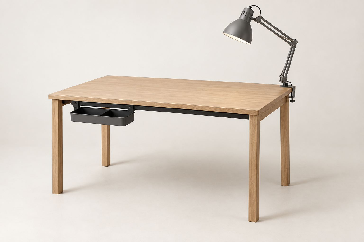 Illustrative oak desk with a clamped task lamp and an organizer attached beneath its front rail